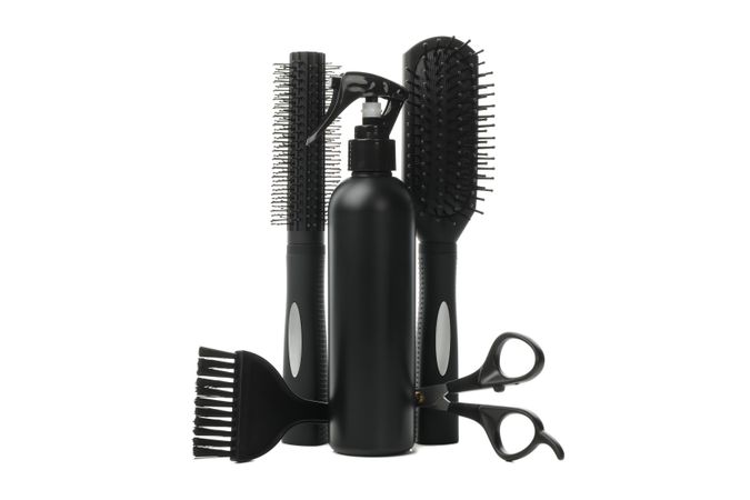Different hairdresser accessories isolated on plain background