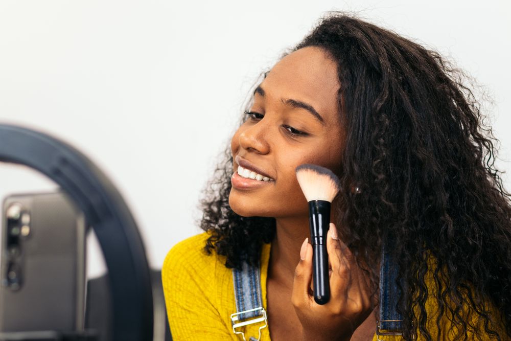 Beauty blogger promoting makeup on social media