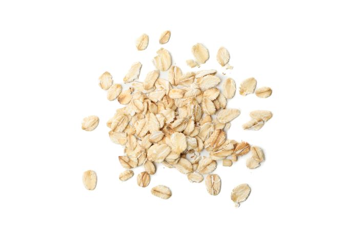 Oatmeal flakes bunch isolated on blank background