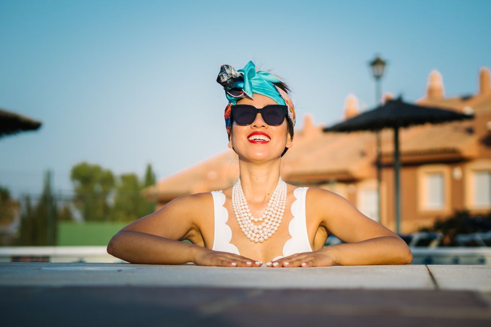 Young elegant Chinese woman sunbathing