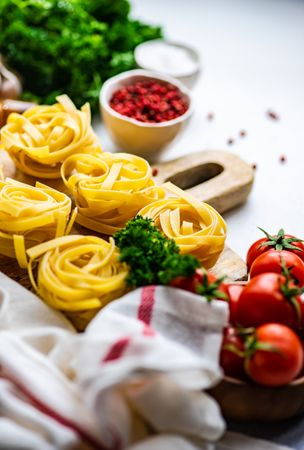 Ingredients for Italian pasta dish on kitchen counter with copy space