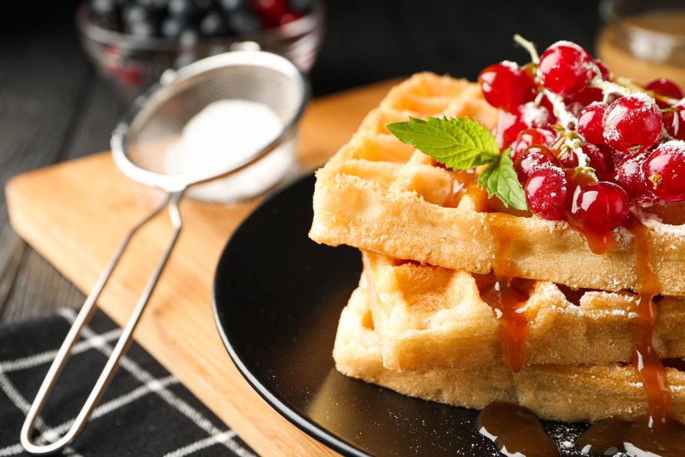 Beautiful composition with sweet waffles, space for text