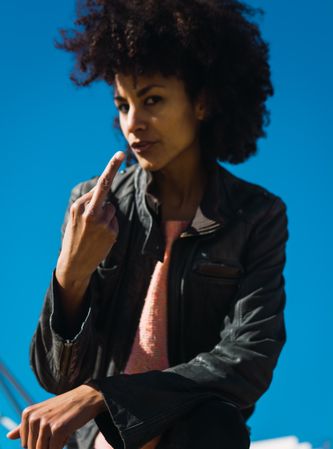 Woman with afro hair making insults.