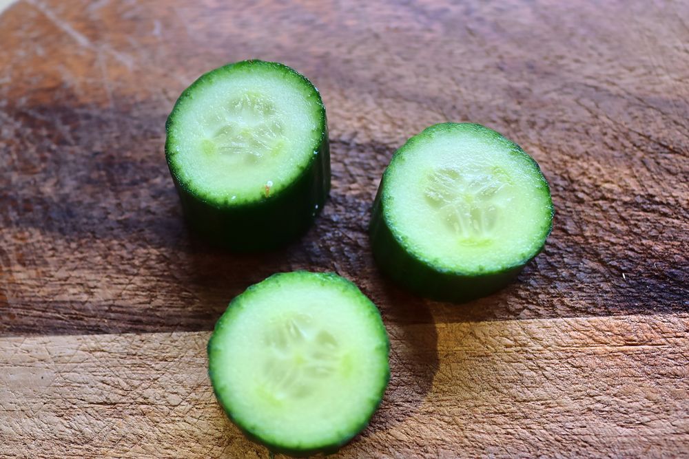 Close view on a healthy german breakfast with sandwiches, tomatoes and cucumbers