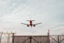 Rear view of airplane landing