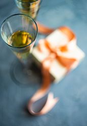 Champagne with gift box in background