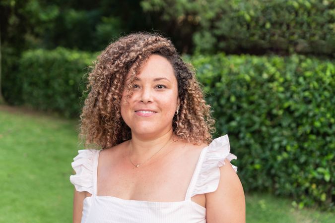portrait of laughing young woman with curly hair