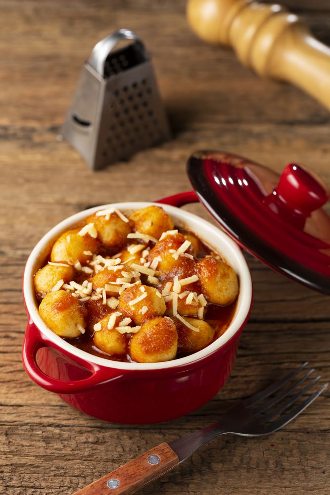 Gnocchi with tomato sauce and grated Parmesan cheese.