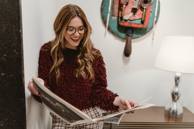 Stylish woman reading magazine