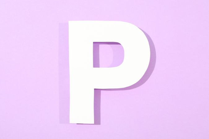 Paper letter P on color background, space for text