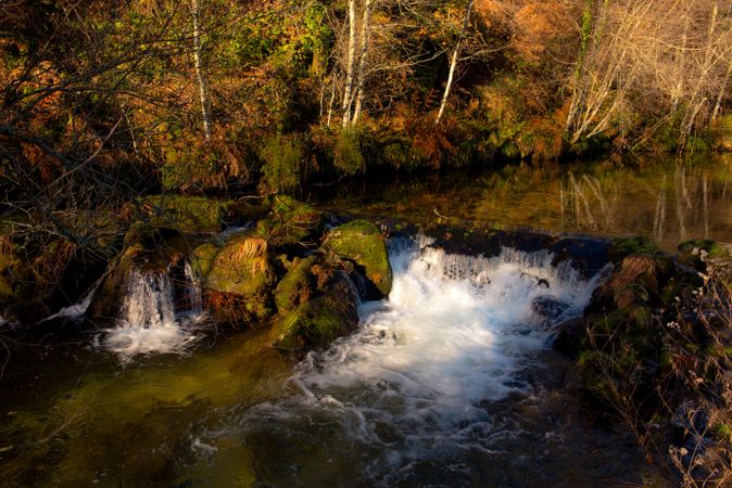 Small waterfall in autumn forest