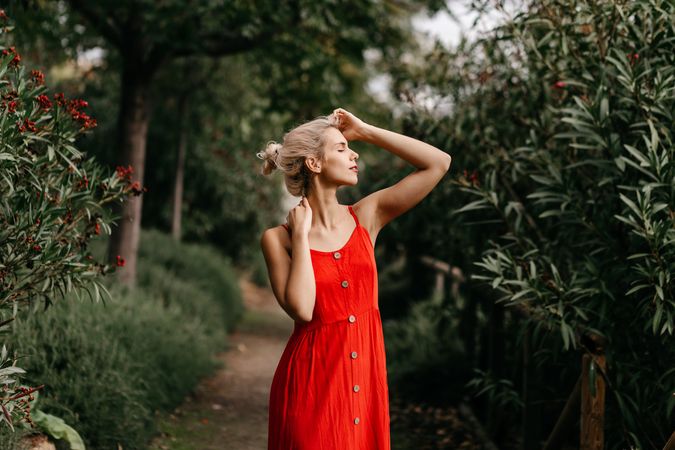 Dreamy young woman in summer garden