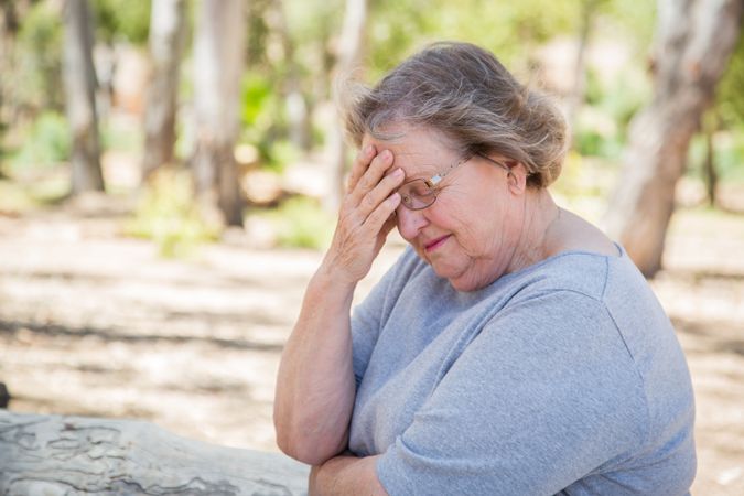 Upset Mature Woman Sitting Alone