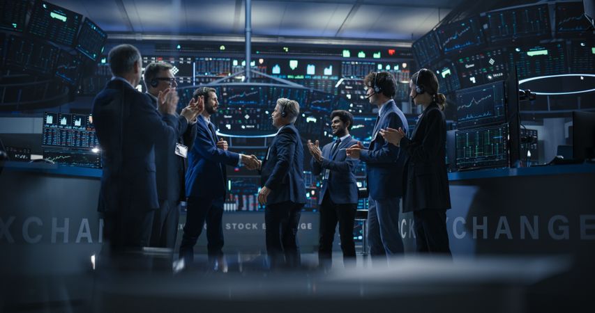Team of Successful Stock Exchange Brokers Celebrating a Profitable Investment Bid on a Securities Market.