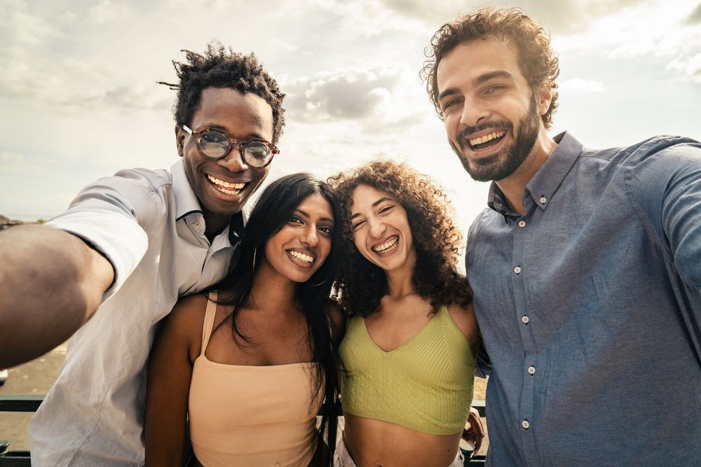 Group of happy friends taking a selfie on vacation