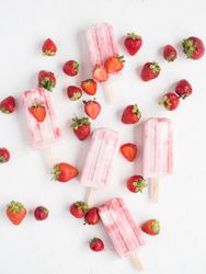 Pink popsicles and fresh strawberries
