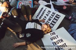 London, England, United Kingdom - September 15th,2019: Protestors lying down with anti-fur signs 5oDOG4