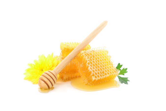 Pieces of honeycomb, chrysanthemum and dipper isolated on blank background