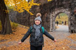 Happy female tourist enjoying autumn in Oslo