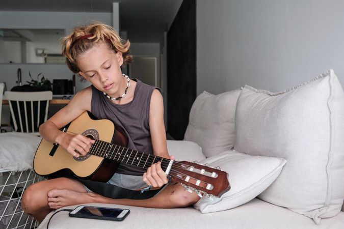 Child playing the guitar