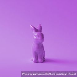 Purple plastic Easter bunny on purple background bDoxk4