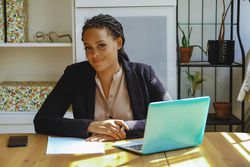 Content female business owner in her home office