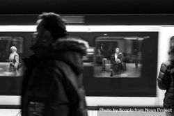 Grayscale photo of people at the subway 0vKAp5