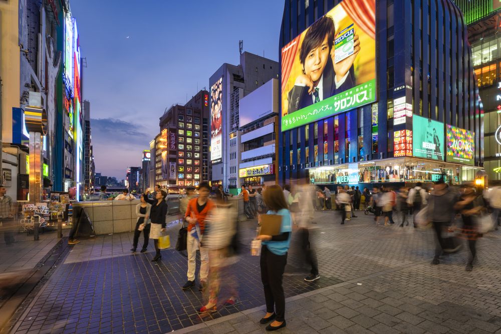People walking down the street during evening in Japan