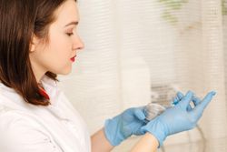 Female esthetician preparing before treatment