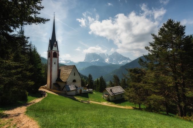 Picturesque church on green hill in forest