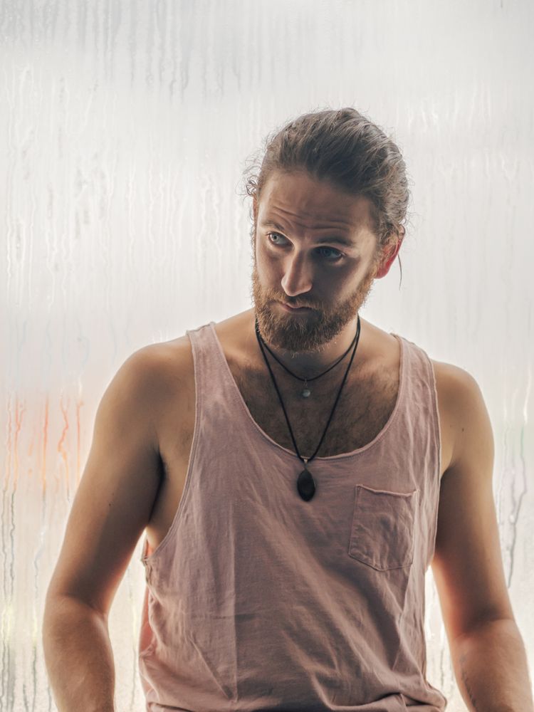 Man in mindfulness on window sill