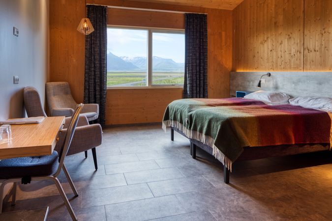 Comfortable hotel room with rural view from window