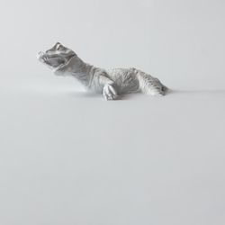 Painted dinosaur on light flat background