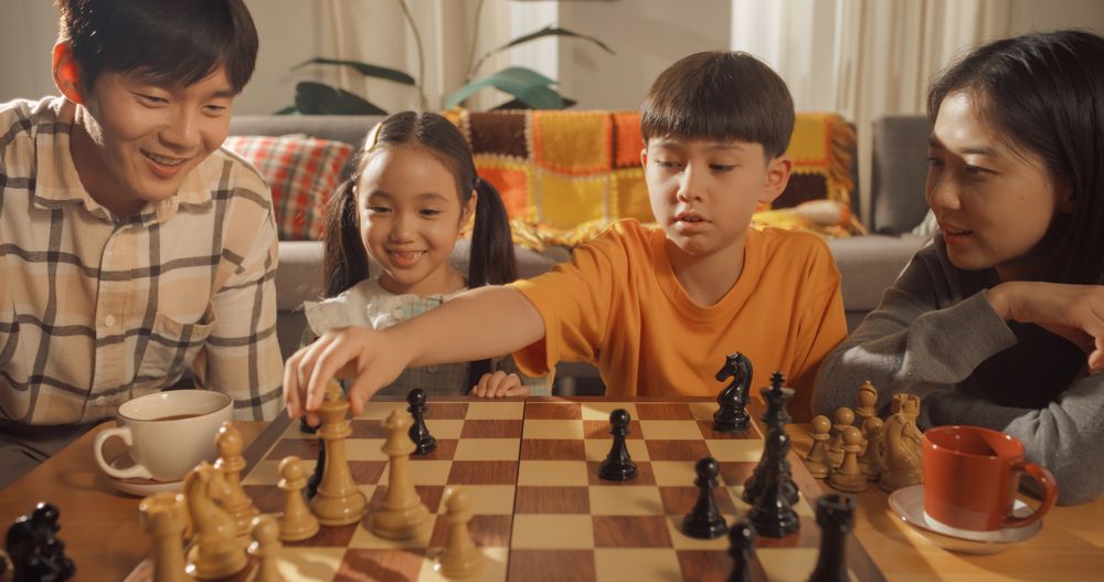 Portrait of a Happy Korean Family Spending Time Together in Their Living Room at Home.
