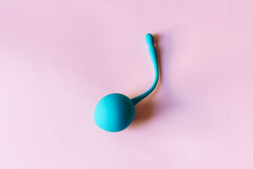 Kegel ball on pink background