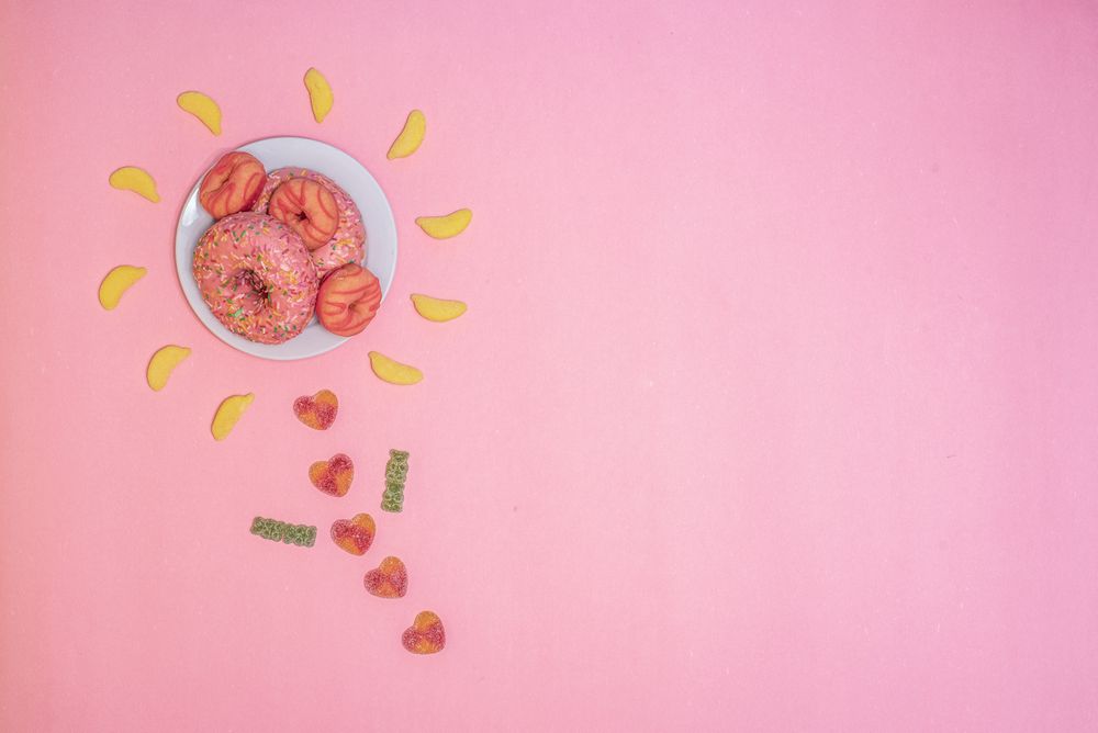 Pink doughnuts in a flower shape made with candies