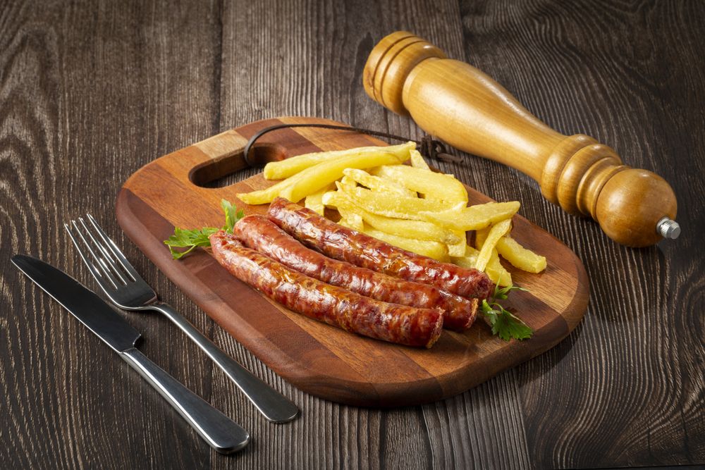Grilled German sausage with french fries.