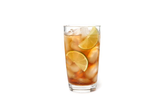 Glass of cold cola isolated on blank background