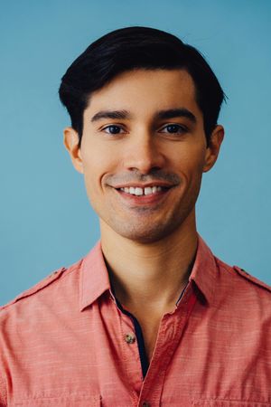 Portrait of smiling Hispanic male, vertical