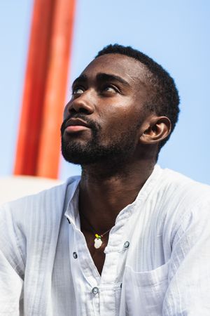 Stylish Black man in city street