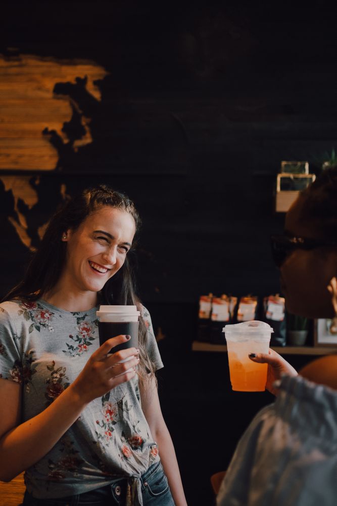 Multiethnic modern women relaxing at coffee shop