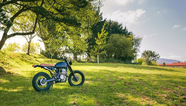 Custom motorcycle parked on the field
