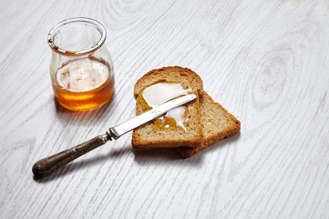 Toast with knife and honey