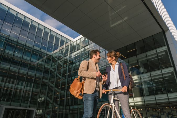 Businesspeople talking on street after work