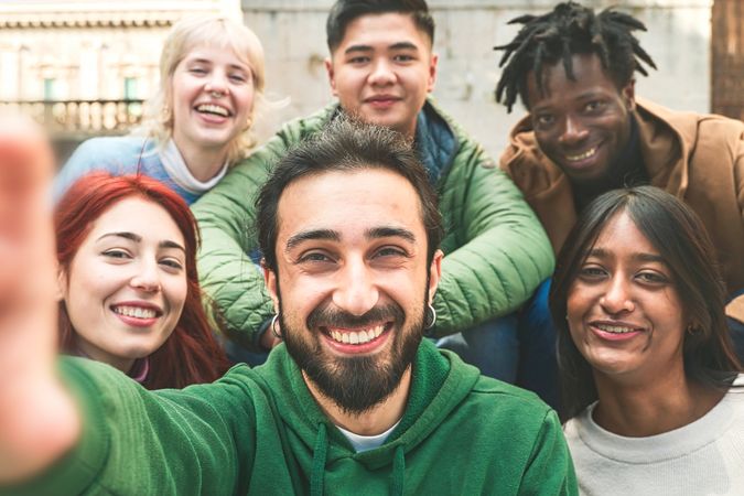 POV of group of diverse friends sharing a joyful moment in a selfie