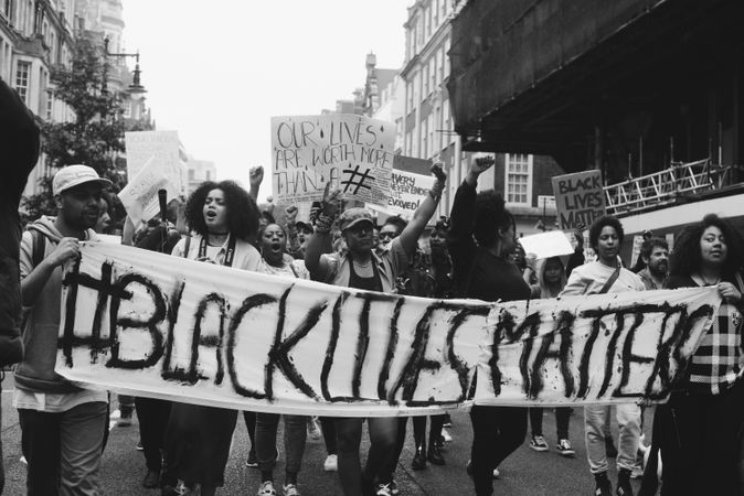 London, England, United Kingdom - June 6th, 2020: group of people carry banner for BLM protest