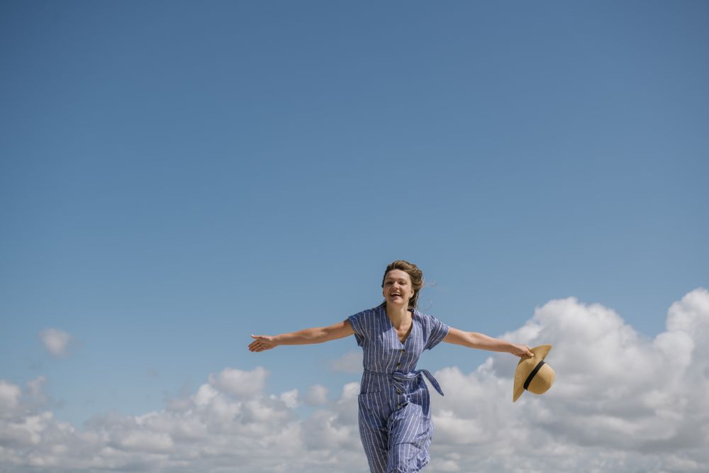 Happy young woman enjoying breeze