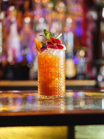 Refreshing cocktail with flower and mint