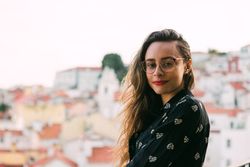 Casual woman against cityscape