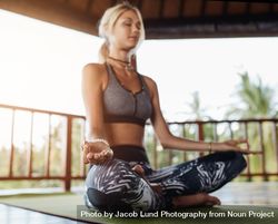 Healthy young female practising yoga bEAlNb